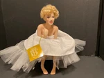 Franklin Mint Porcelain Marilyn Monroe Doll Love, Sitting Satin Bench. Fixed Price $150.00.