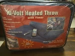 Trillium 12 Volt Heated Throw W/timer Black Fleece 42" X 52". Fixed Price $19.97.