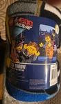 The Lego Movie Plush Throw Blanket 46" X 60" Gray Glow Dark- New Packaging. Fixed Price $19.95.