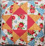 Pioneer Woman Patchwork Rose Throw Pillow. Fixed Price $25.00.