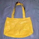St. John Yellow Patent Coated Canvas Expandable Tote Bag Striped Handles Logo. Fixed Price $99.00.