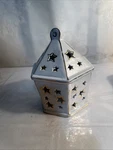Hexagonal Prism Porcelain Tea Light Holder With Star Cutouts For Cozy Ambiance. Fixed Price $9.07.