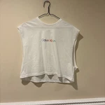Calvin Klein White Cotton Jersey Cropped Sleeveless Logo Tank Top Crew Neck. Fixed Price $20.00.