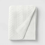 50"X60" Dimensional Knit Throw Off White - Threshold. Fixed Price $12.99.