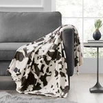 Brookstone Cozy Heated Plush Throw Blanket, Cow Print, 1 Touch Built-in Control. Fixed Price $29.98.